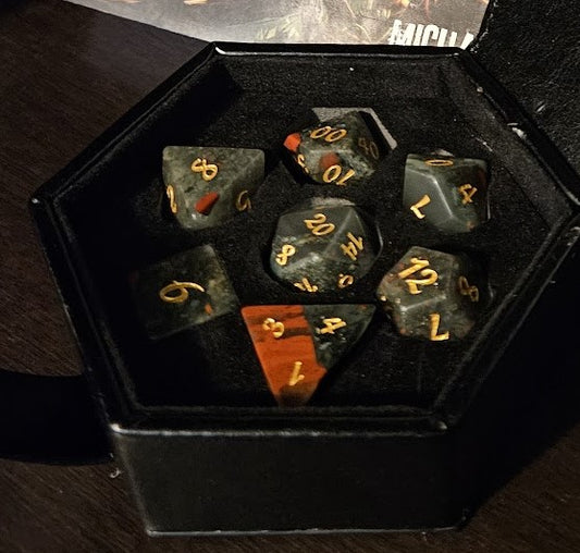 Legendary Quarterly Dice "Bleeding Stone Dice" and "Journeys Outside the Keep" newsletter